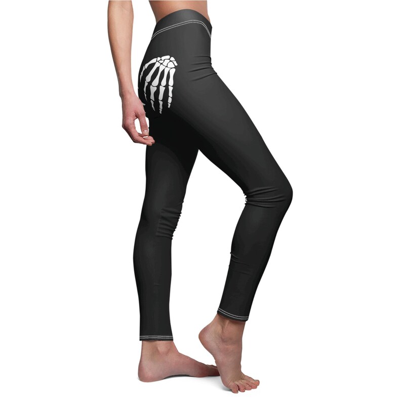 side view of black skeleton hands leggings