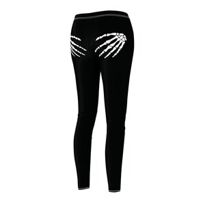 playful black leggings showing two skeleton hands on the rear