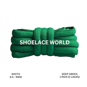 May include: Deep green shoelaces, 8.5-9mm wide, coiled and displayed against a white background. The text "SHOELACE WORLD" is printed across the laces. The product is labeled as "DEEP GREEN 1 PAIR (2 LACES)".