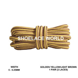 May include: A pair of golden yellow and light brown shoelaces, tightly coiled. The shoelaces are 5-5.25mm wide. The text "SHOELACE WORLD" is printed on the shoelaces. The product is labeled as "GOLDEN YELLOW/LIGHT BROWN 1 PAIR (2 LACES)".