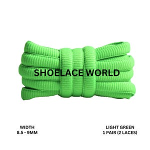 May include: Light green shoelaces, 8.5-9mm wide, coiled and displayed against a white background. The text "SHOELACE WORLD" is printed on the shoelaces. The image also includes the text "LIGHT GREEN 1 PAIR (2 LACES)".