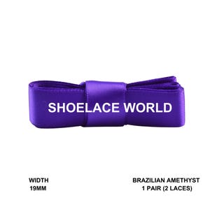 May include: A pair of Brazilian Amethyst shoelaces, 19mm wide, in a vibrant purple color. The text "SHOELACE WORLD" is printed in white across the shoelaces.