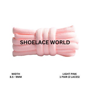 May include: Light pink shoelaces, 8.5-9mm wide, coiled on a white background. The text "SHOELACE WORLD" is printed on the shoelaces. The text "LIGHT PINK 1 PAIR (2 LACES)" is printed below the shoelaces.