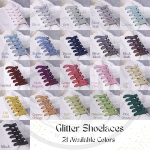 May include: A variety of glitter shoelaces in 21 colors are displayed on white sneakers. Colors include opal, silver, blue, red, pink, and green. The text "Glitter Shoelaces" and "21 Available Colors" are also shown.