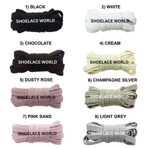 May include: Eight bundles of flat shoelaces arranged in two columns. Colors include black, white, chocolate, cream, dusty rose, champagne silver, pink sand, and light grey. Each bundle is labeled with the text SHOELACE WORLD in black or white.