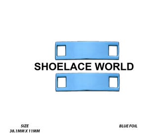 May include: A pair of rectangular blue foil shoelace tags with square cutouts on each end. The tags measure 38.1mm by 11mm with a 5mm hole for lace insertion. The text SHOELACE WORLD is centred between the two tags on a plain white background.