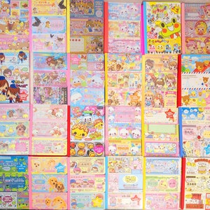 May include: A collection of 36 colorful, illustrated, and patterned paper notebooks. The notebooks feature various designs, including animals, flowers, and geometric patterns. The notebooks are all approximately 4 inches wide and 6 inches tall.