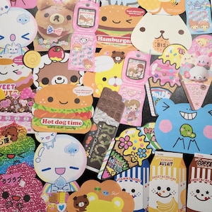 May include: A collection of colorful, cartoon-themed stickers featuring various characters, animals, and food items. The stickers are printed on white paper and have a glossy finish. Some of the stickers have text, such as "Hot dog time", "Banana AULait", and "Coffee".