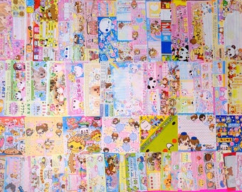 Puede incluir: Un collage de hojas de papel de colores con personajes de dibujos animados y texto japonés. Las hojas están decoradas con varios temas, incluyendo animales, comida y festividades.