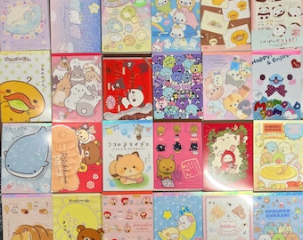 May include: A grab bag of San-X memo sheets featuring various characters, including Rilakkuma, Sumikko Gurashi, and Jinbeoan. The memo sheets are in a variety of colors and designs, and each one has a different character on it. The bag is a great way to get a variety of memo sheets for a great price.