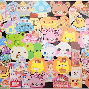 May include: A collection of colorful, cartoon-themed stickers featuring various characters, including bears, mushrooms, and a frog. The stickers are arranged in a grid pattern on a white background.