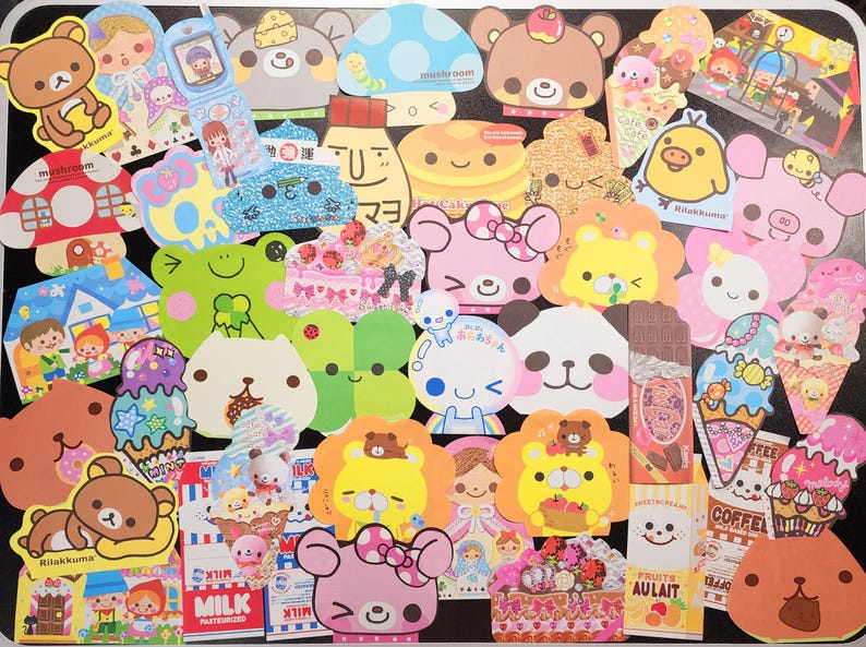 May include: A collection of colorful, cartoon-themed stickers featuring various characters, including bears, mushrooms, and a frog. The stickers are arranged in a grid pattern on a white background.
