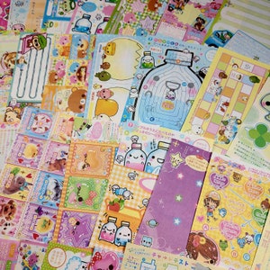 May include: A collection of colorful Japanese cartoon character stickers featuring a variety of characters, including animals, people, and food. The stickers are printed on white paper and have a glossy finish.