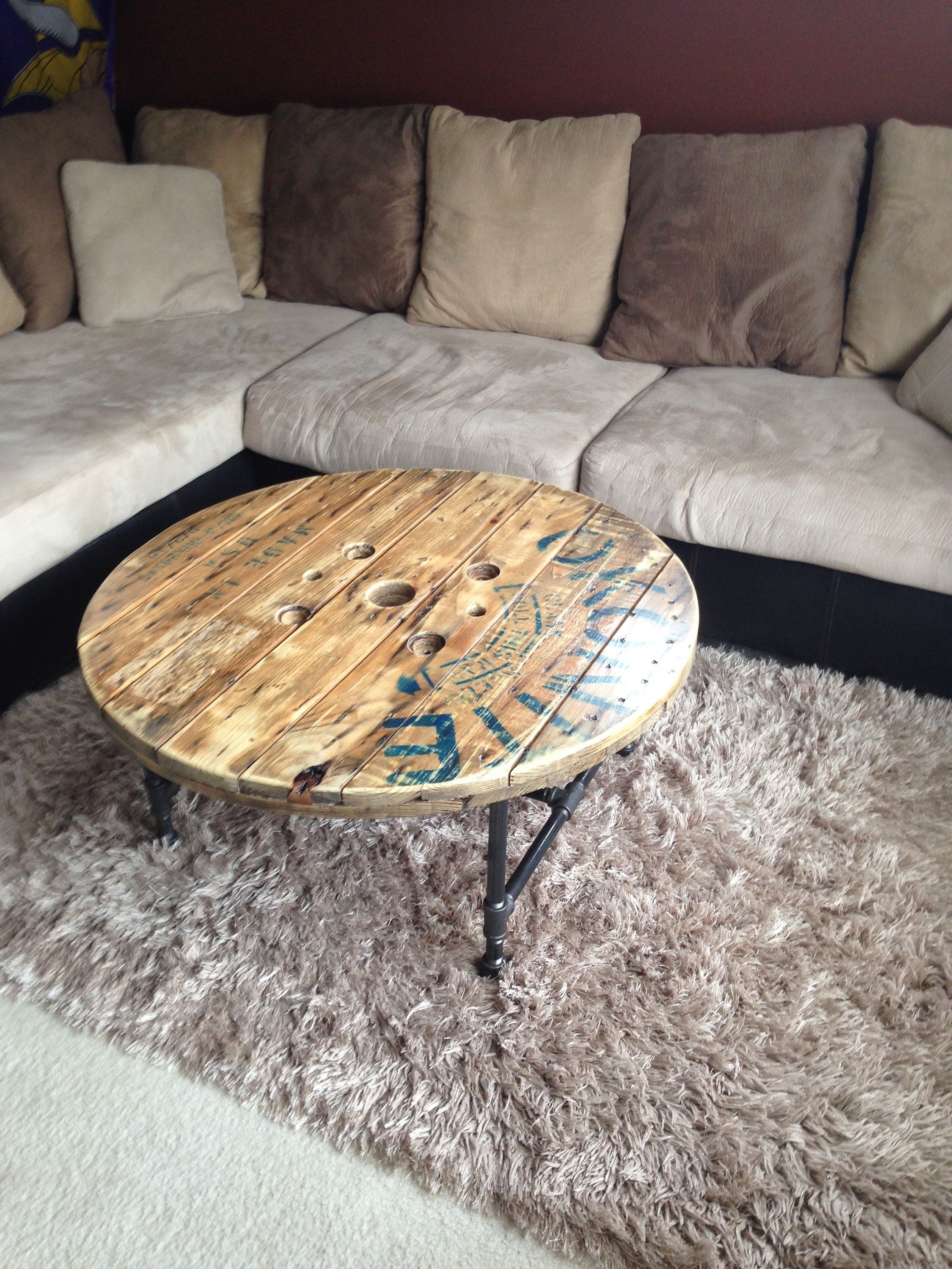 Recycled wire spool table with iron p...