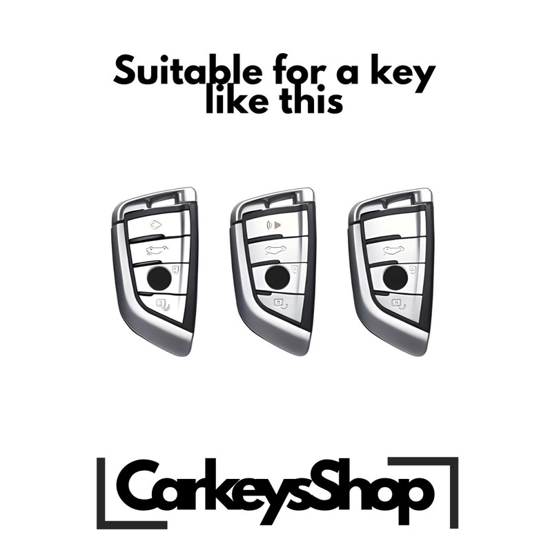 Może przedstawiać: Trzy srebrne breloki do kluczyk&oacute;w samochodowych z wieloma przyciskami. Breloki nadają się do kluczyka takiego jak ten. Tekst "CarkeysShop" znajduje się w dolnej części środkowej obrazu.