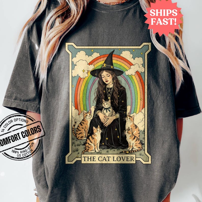 May include: A vintage-style illustration of a witch with a rainbow behind her, surrounded by four cats. The text "The Cat Lover" is at the bottom of the image.