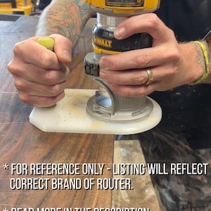 May include: A yellow and black DeWalt router being used on a piece of wood. The router has a white base and is held by a person. The text on the image says "FOR REFERENCE ONLY - LISTING WILL REFLECT CORRECT BRAND OF ROUTER" and "READ MORE IN THE DESCRIPTION."