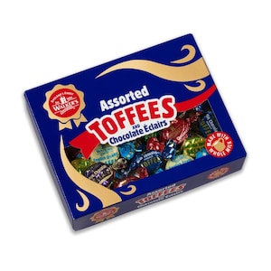 May include: A blue box with gold accents containing assorted toffee and chocolate eclairs. The box has a red ribbon and a gold seal with the text "England's Finest Walker's of  Cornwall". The box also has the text "Assorted Toffees and Chocolate Éclairs" and "Made with Whole Milk".