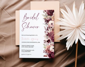 May include: A white bridal shower invitation with a floral border. The invitation reads "Bridal Shower" in cursive script and "Join us in honoring bride-to-be Isabella Gomez" in pink script. The invitation also includes the date, time, and RSVP information.