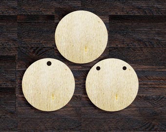 May include: Three round wooden ornaments with a natural wood grain finish. Each ornament has a small hole at the top for hanging. The ornaments are arranged on a dark brown wooden surface.