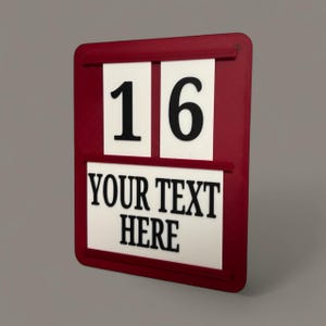 May include: A rectangular maroon sign featuring two white panels at the top displaying the black number 16 and a larger white panel below with the black text YOUR TEXT HERE. The sign has a frame with horizontal slots for holding the panels in place.
