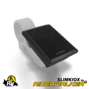 May include: A black and grey SlimkIOX by Riderwalker bike computer mount with a Bosch logo. The mount is attached to a white handlebar clamp.