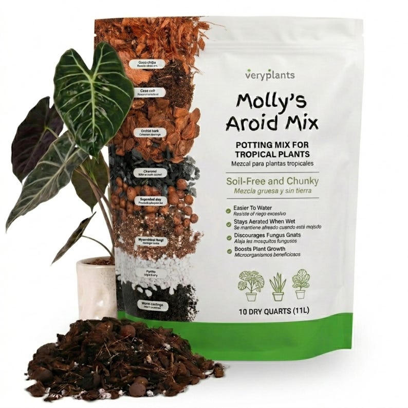 May include: A bag of "Molly's Aroid Mix" potting mix for tropical plants. The white bag features the product name, a list of benefits, and a cross-section of the mix's components. A potted plant with large, dark green leaves is to the left, and a pile of the mix is in front.