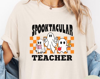 女性用教師ハロウィンシャツ、教師ゴーストTシャツ、不気味な季節の教師へのギフト、トリックオアトリートゴーストシャツ、スパイクタキュラー教師Tシャツ
