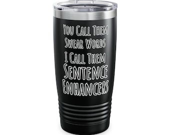May include: Black stainless steel tumbler with white text that reads "You call them swear words I call them sentence enhancers".