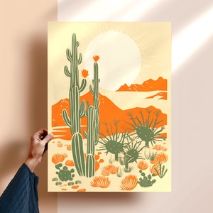 woman holding giclee art print of modern desert cactus, desert poster, linocut cactus art, danish modern aesthetic, beige contemporary art, mid century art, block print cactus, kinfolk magazine, southwest art, cactus poster, orange, sage green
