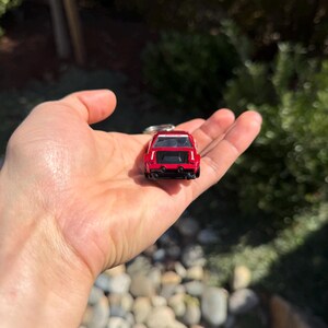 May include: A set of three ceramic mugs with a speckled, matte finish. The mugs are in shades of cream, light gray, and dark gray. Each mug has a simple, minimalist design and a rounded handle.