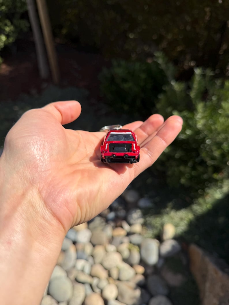 May include: A set of three ceramic mugs with a speckled, matte finish. The mugs are in shades of cream, light gray, and dark gray. Each mug has a simple, minimalist design and a rounded handle.