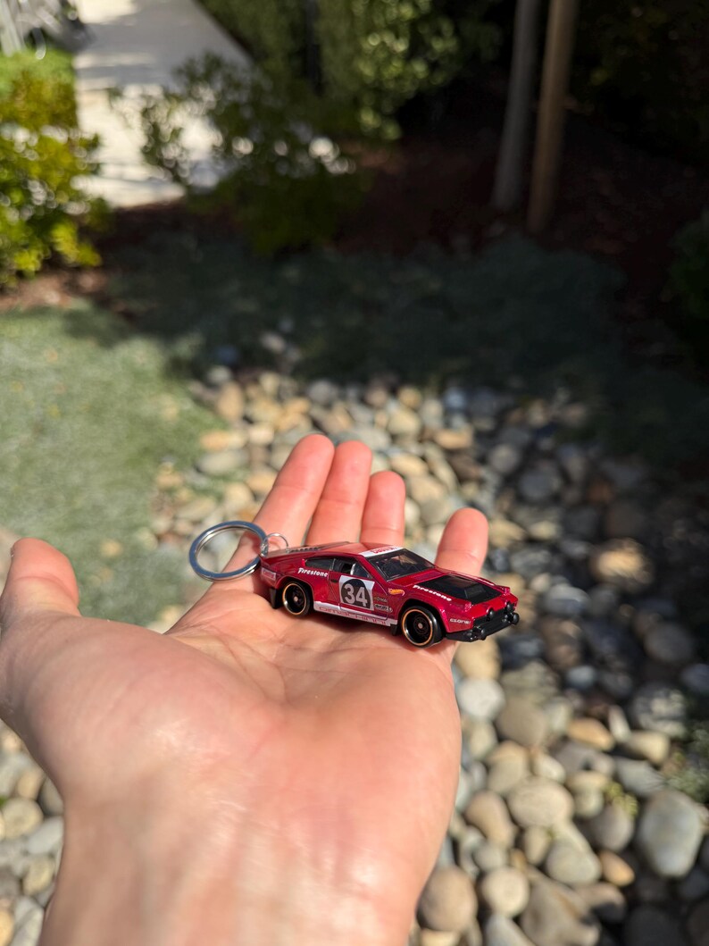 May include: A handmade wooden sign with the text "Welcome" in a playful font. The sign features a distressed white background and a dark brown border, perfect for a front door or entryway. Measures approximately 12 inches wide.