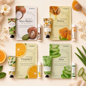 May include: Four KONEUK collagen essence mask packets labeled Shea Butter, Honey, Vitamin C, and Aloe, each paired with a matching hand cream tube and lip balm. The packets display 25g/0.8 oz net weight and feature illustrations of their ingredients.