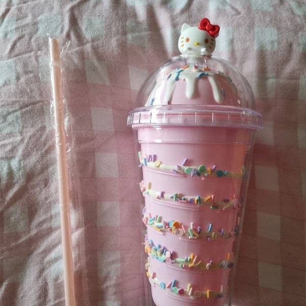 HK and Cinna tumbler with lid and straw.