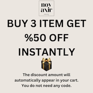 May include: Promotional graphic with the text "BUY 3 ITEM GET %50 OFF INSTANTLY." A black gift box with a gold bow is featured below the text. The text "The discount amount will automatically appear in your cart. You do not need any code." is also included.
