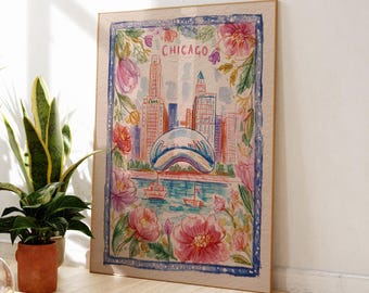 May include: Watercolor painting of the Chicago skyline, featuring the Bean sculpture and surrounding buildings. The artwork is framed with a blue border and floral accents, with the word "Chicago" at the top. The color palette includes pink, blue, and beige.