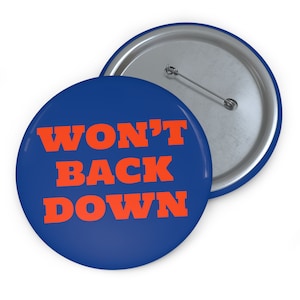 May include: A blue button with the text "WON'T BACK DOWN" in orange letters.