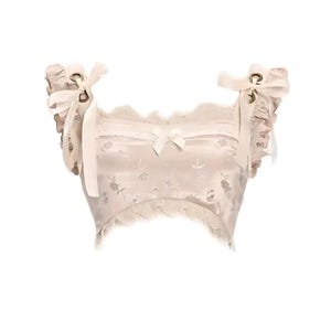 May include: A white satin crop top with lace trim and a floral pattern. The top has a square neckline and adjustable straps with bows and eyelets.