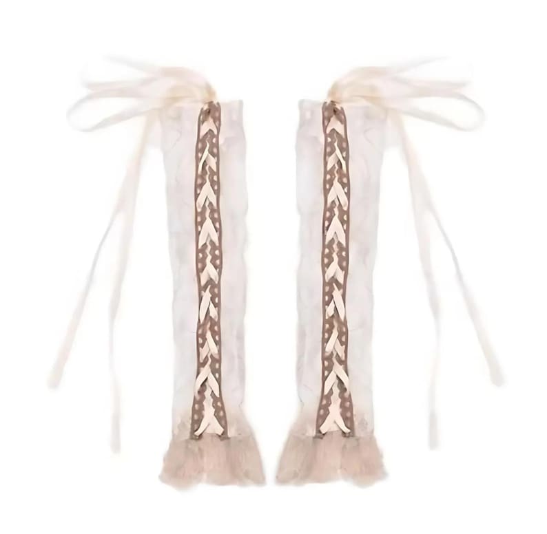 May include: A pair of white lace arm warmers with brown braided trim and long ties.