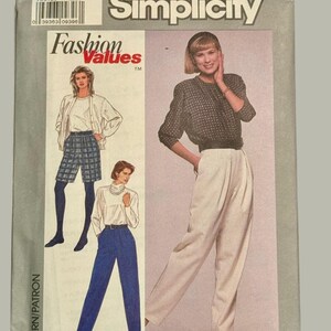 May include: Simplicity sewing pattern 9295 featuring fashion values. The pattern includes illustrations of women's clothing, including a jacket, skirt, pants, and blouse. The pattern's size is A, and it includes all sizes.