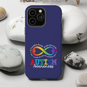 May include: A navy blue phone case with a colorful infinity symbol and the words "AUTISM Awareness". The infinity symbol is in rainbow colors, and the text "I wouldn't change you for the world, but I would change the world for you" is also included.