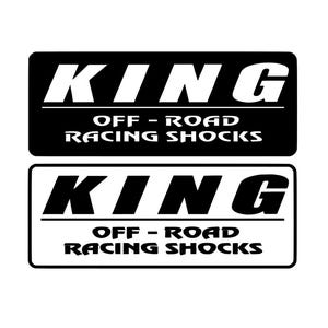 May include: Two rectangular black and white logos. The top logo is black with white text that reads "KING" above "OFF - ROAD RACING SHOCKS". The bottom logo is white with black text that reads "KING" above "OFF - ROAD RACING SHOCKS".