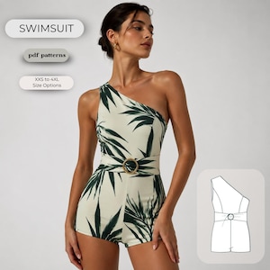 May include: A one-shoulder swimsuit featuring a cream base with a dark green palm leaf print, a matching fabric belt with a gold-tone circular buckle, and a technical line drawing illustration showing the garment construction and design details.