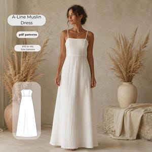 Puede incluir: Un vestido largo blanco de corte en A hecho de muselina con tirantes finos y un corpiño ajustado. El texto en la imagen dice A-Line Muslin Dress, pdf patterns y XXS to 4XL Size Options. Se incluye un dibujo técnico del vestido.