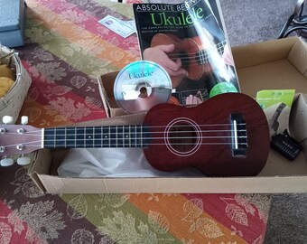 Lanikai LU-11 Soprano Ukulele like new, with instructions, cd disc, cherub tuner