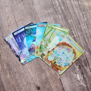 May include: A collection of Magic: The Gathering cards featuring various landscapes. The cards include "Plains," "Island," "Swamp," "Mountain," "Forest," "Command," and "Sol Ring." Each card showcases unique artwork with vibrant colors and detailed illustrations.