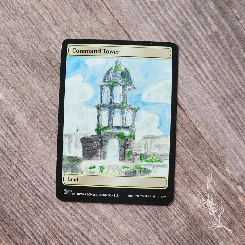 May include: A custom-painted card featuring a watercolor illustration of a tower with the text "Command Tower" and "Land". The tower is depicted in a detailed, artistic style with a blue sky background. The card is labeled "NOT FOR TOURNAMENT PLAY".