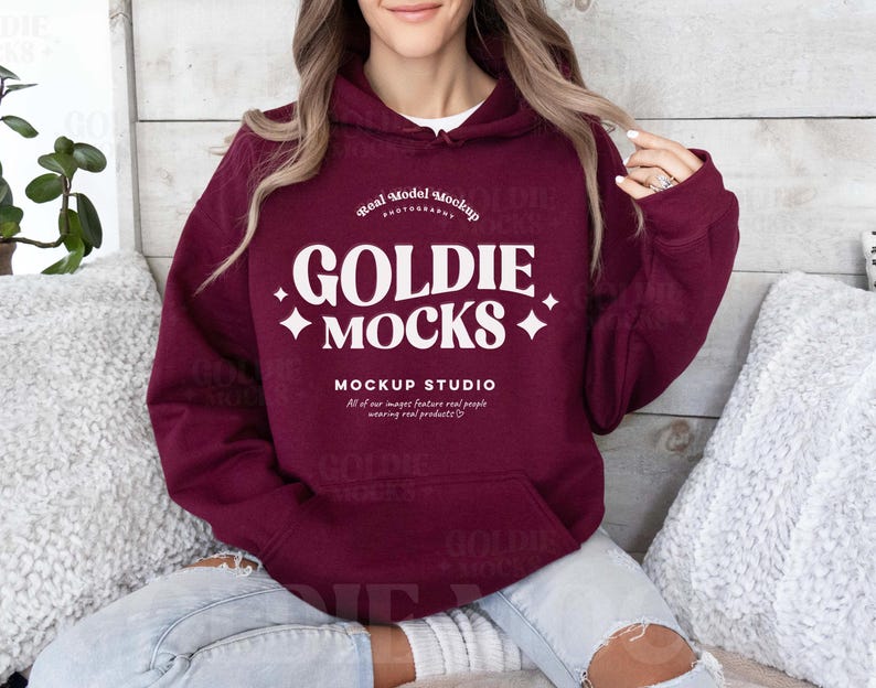 May include: A maroon hoodie with a white graphic that says "GOLDIE MOCKS MOCKUP STUDIO" and "Real Model Mockup Photography".