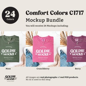 May include: A mockup bundle of 24 t-shirts in various colors, including moss green, pink, and berry. The t-shirts feature a logo with the text "Goldie Mocks" and a plus sign. The image shows the t-shirts laid out on a white surface with a variety of props, including dried flowers, jeans, and a fluffy white rug.